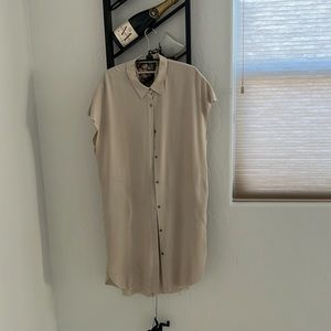 Tan looks nice on, has pockets